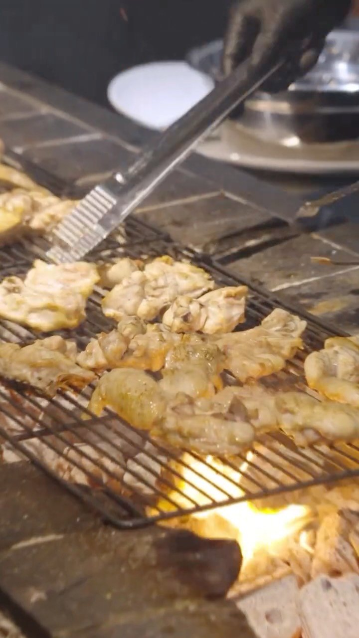 Official Dalmaji Gwangjang Barbecue photo of chicken cooking over a charcoal grill