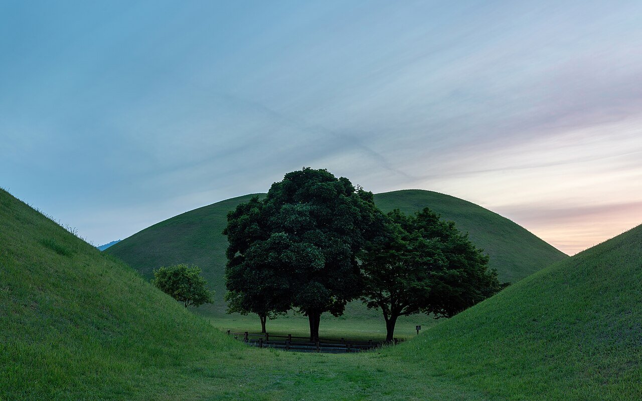 Grassy burial mounds and trees at Daereungwon Tomb Complex in Gyeongju