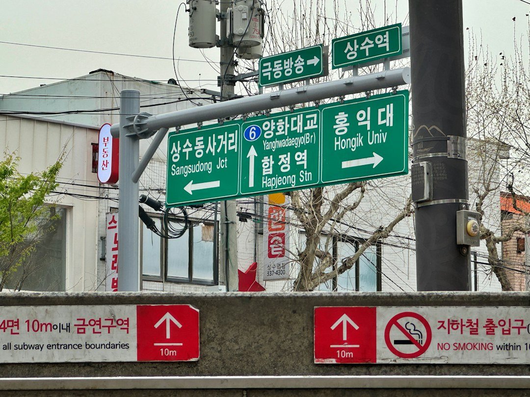 Green street signs on a Korean city street