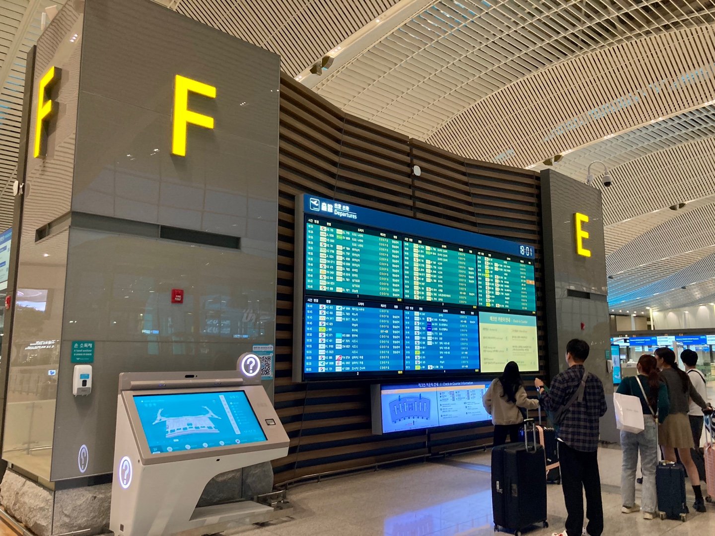 Check-in area F and departure information board at Incheon Airport Terminal 2, South Korea